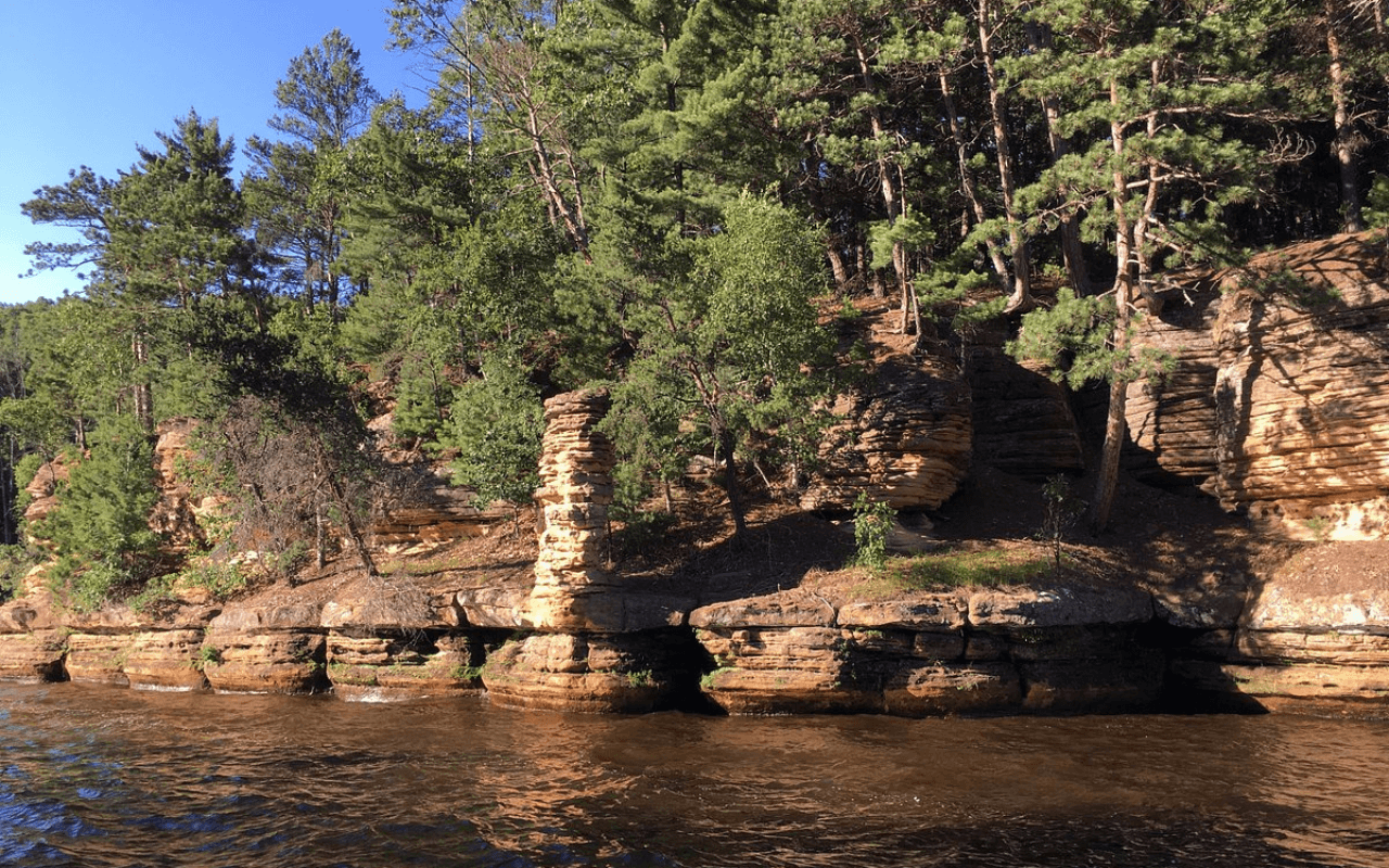 rocks and trees on the water