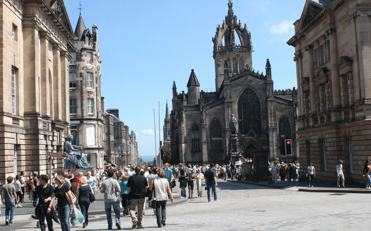 tons of people walking outside in scotland