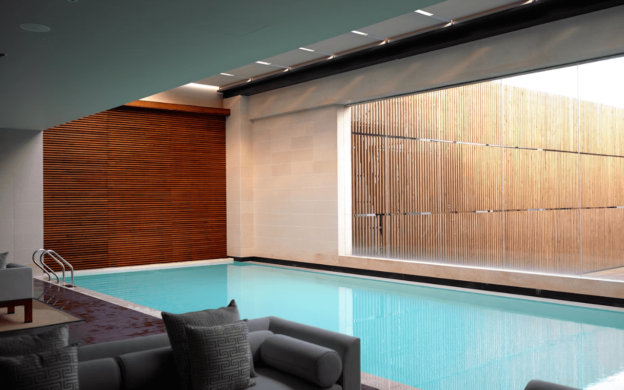 view of indoor pool with bamboo decor on wall