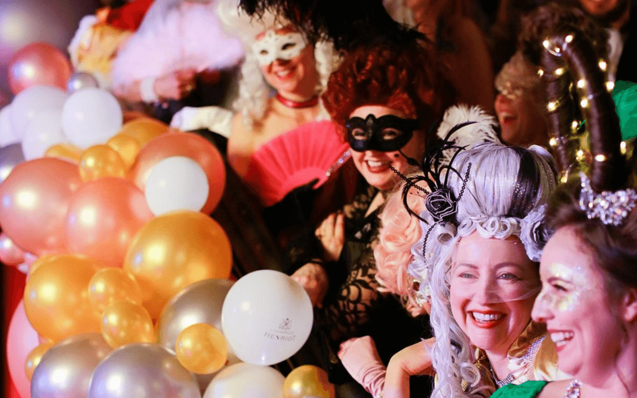 people dressed up for mardi gras