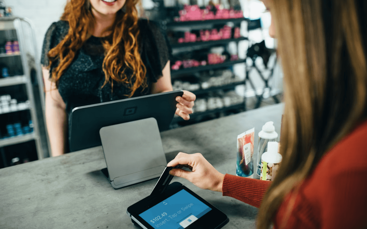 customer using a credit card to check out at a store