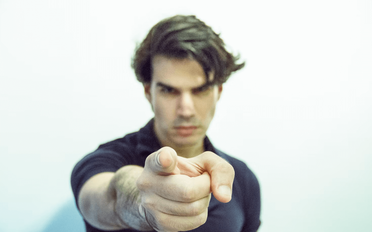 guy pointing finger towards camera