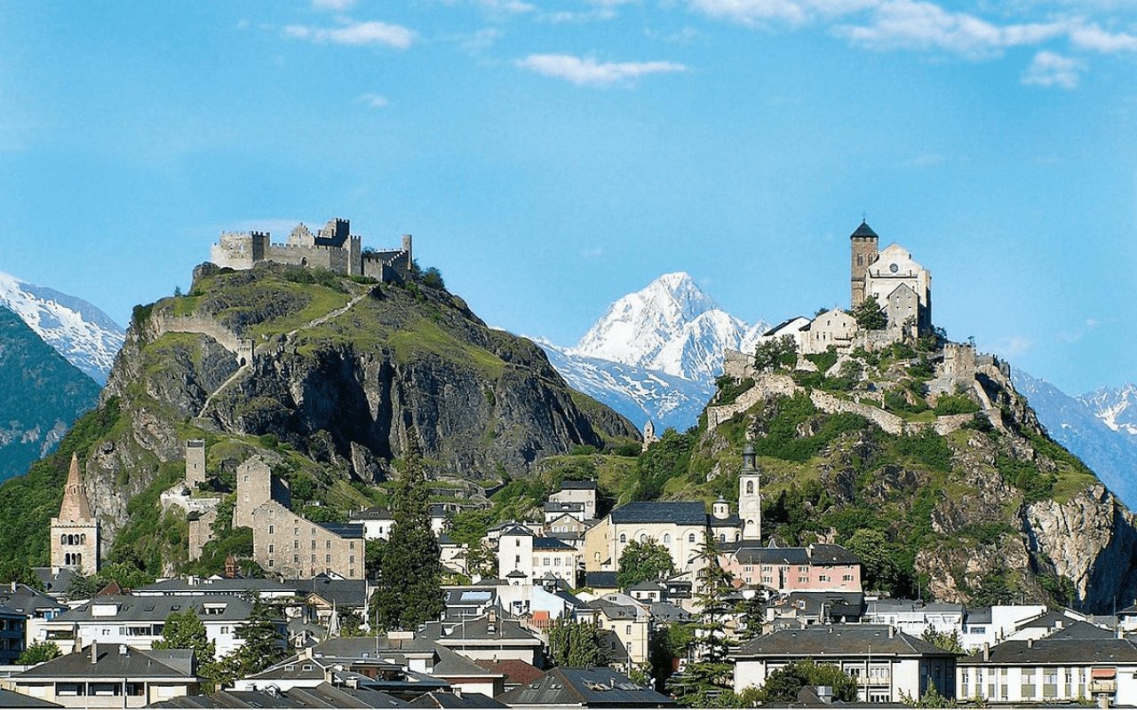 castle and houses on a mountain top