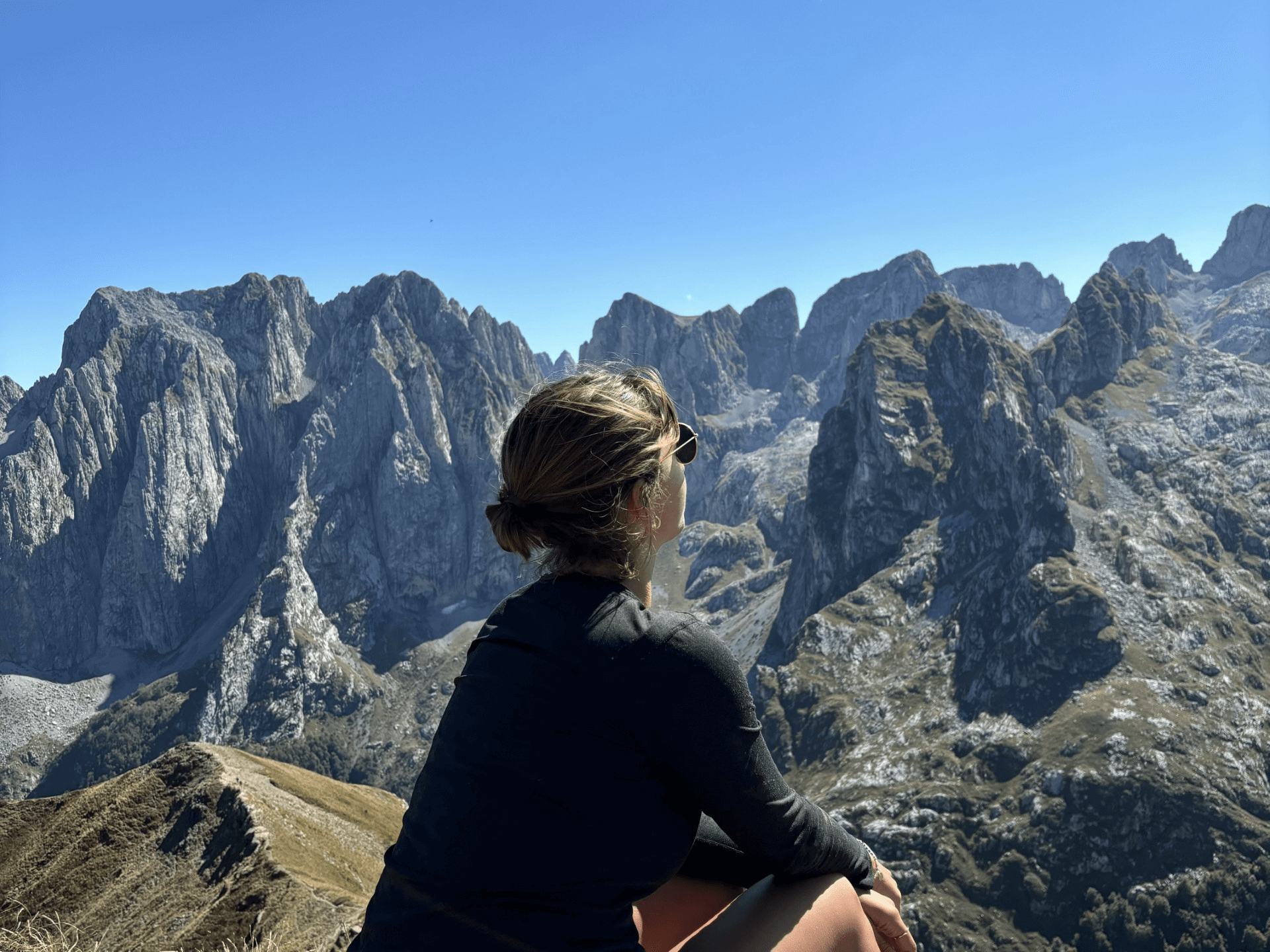 girl sitting on a mountain