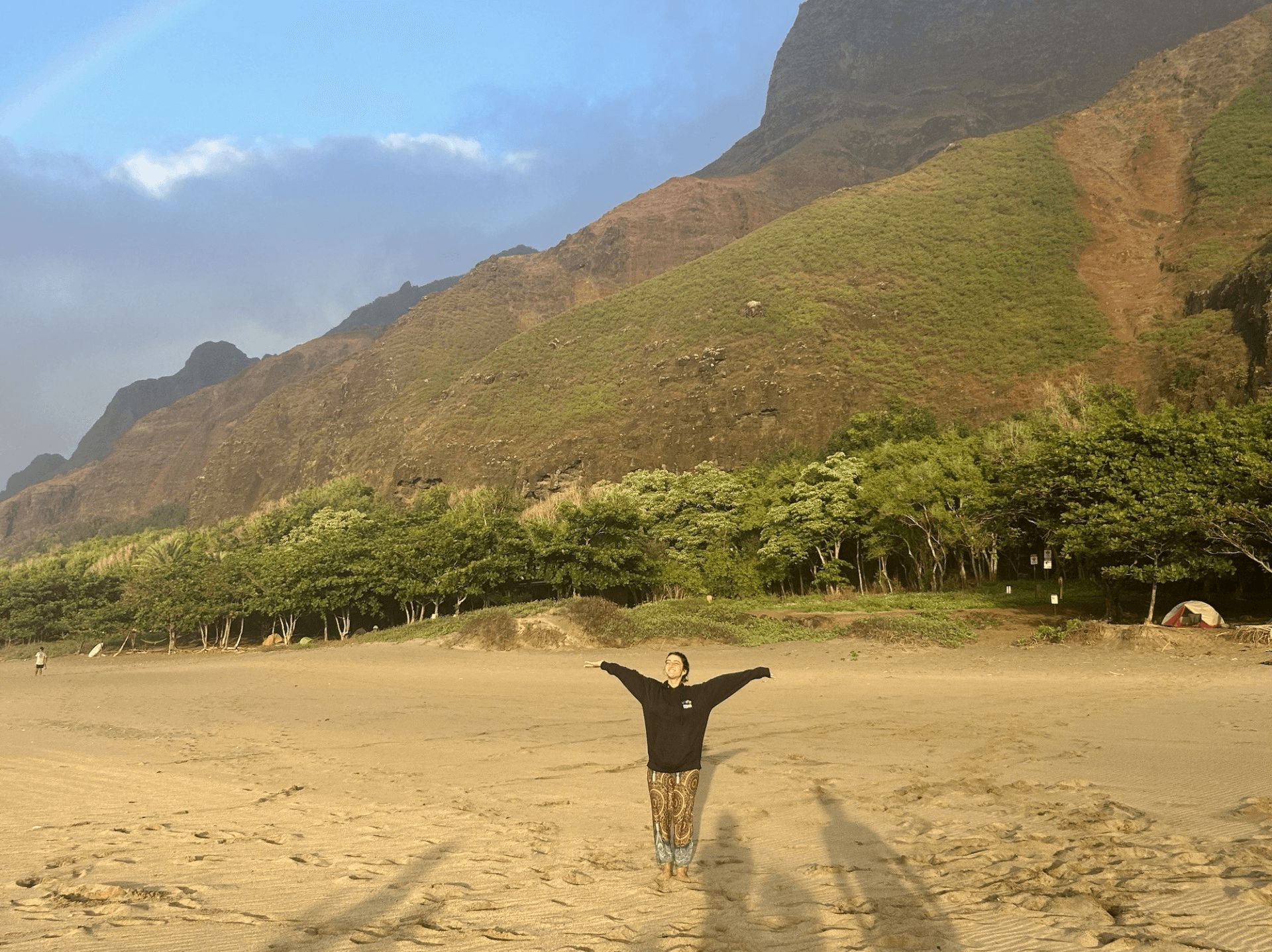 girl raising hands in desert