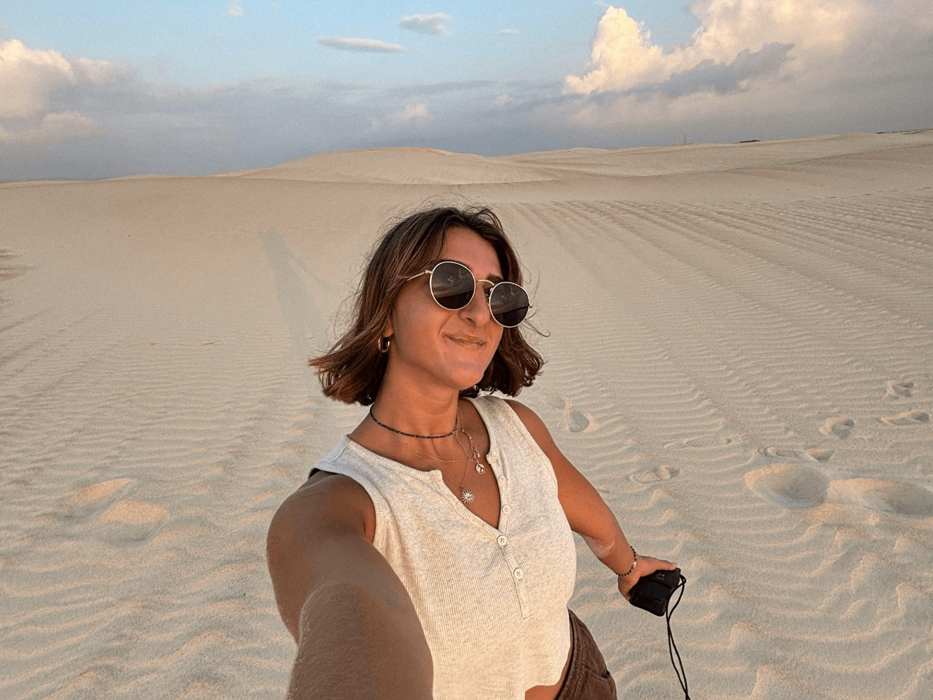 girl taking a selfie on the beach