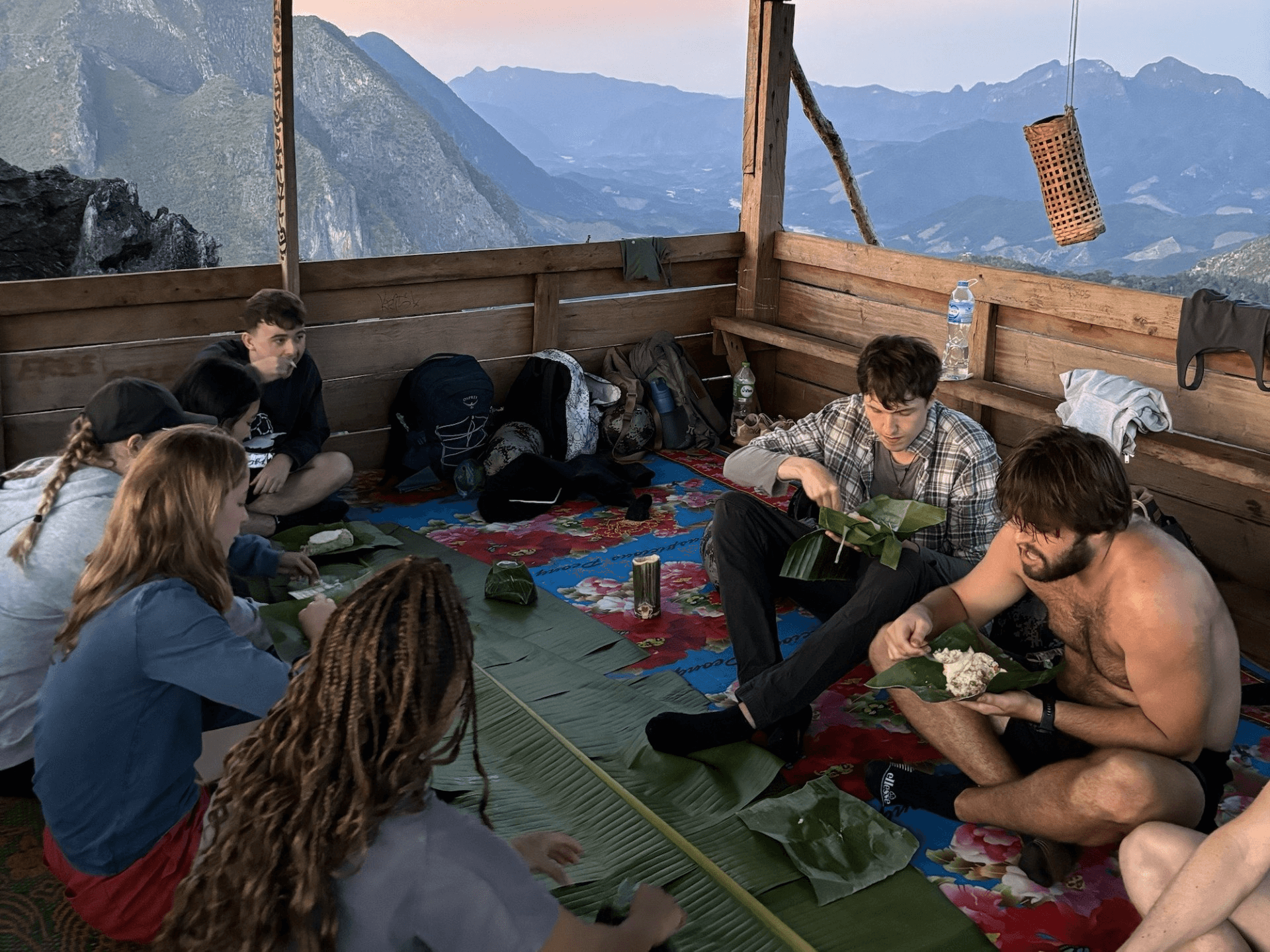 people sitting down and eating