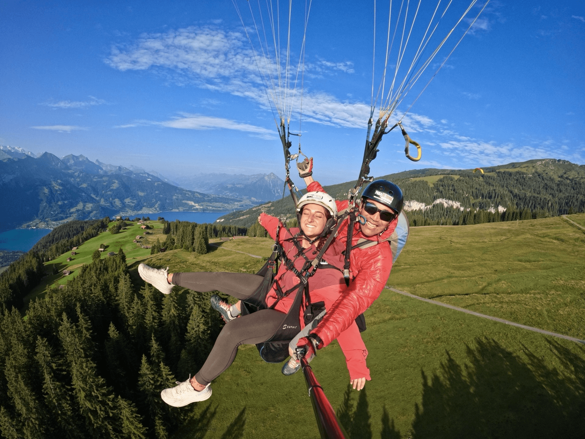 people getting ready to paraglide
