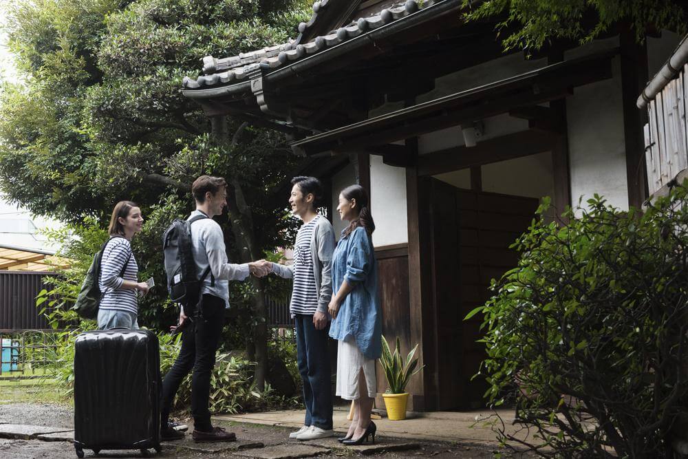 Guests entering a Japanese guest house