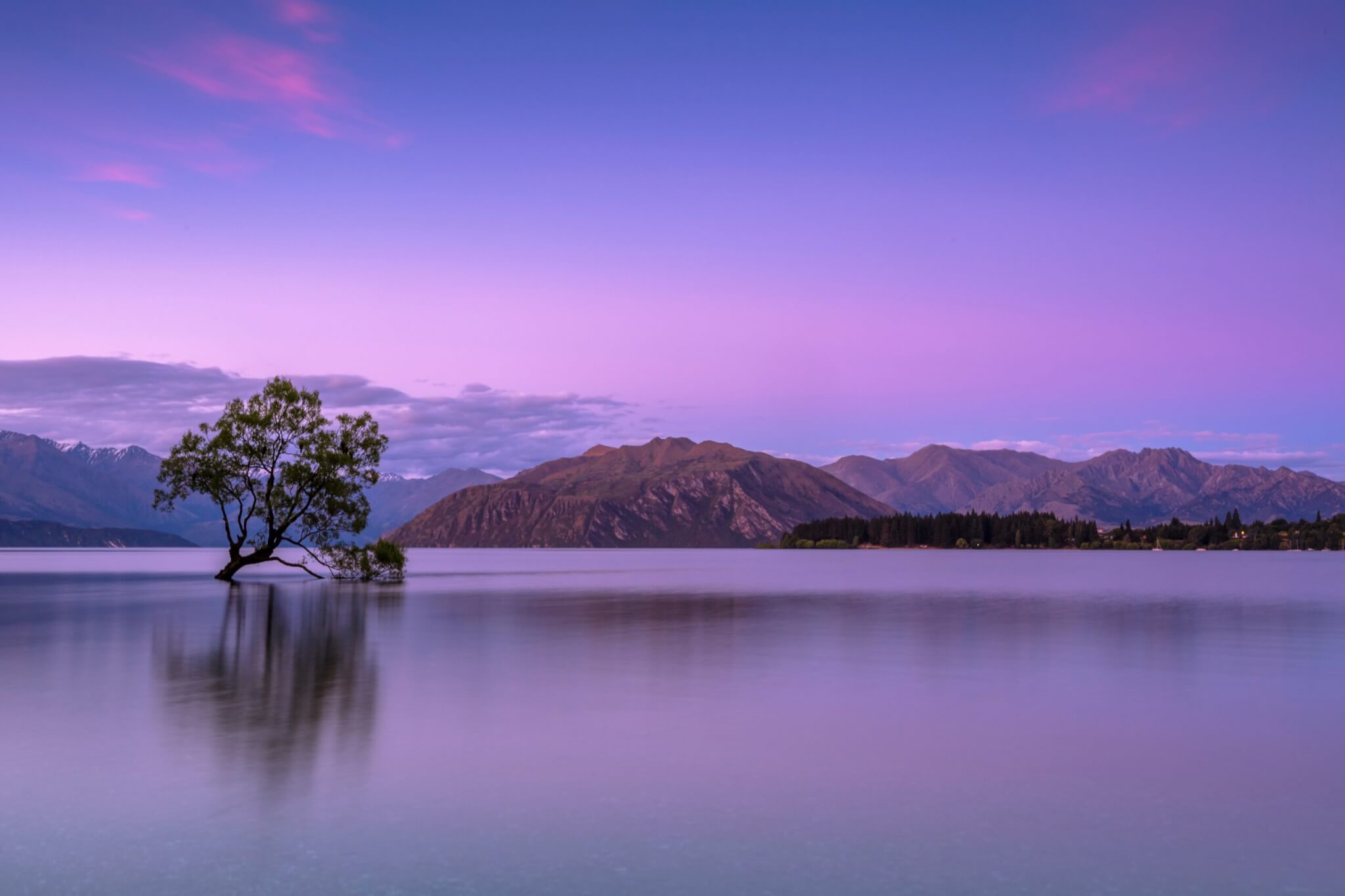 Sunrise over Lake Wanaka in New Zealand, symbolizing new beginnings and wanderlust for the best places to visit in January.