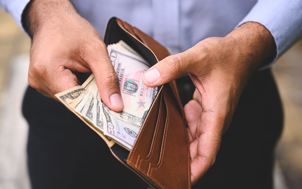 Man opening wallet