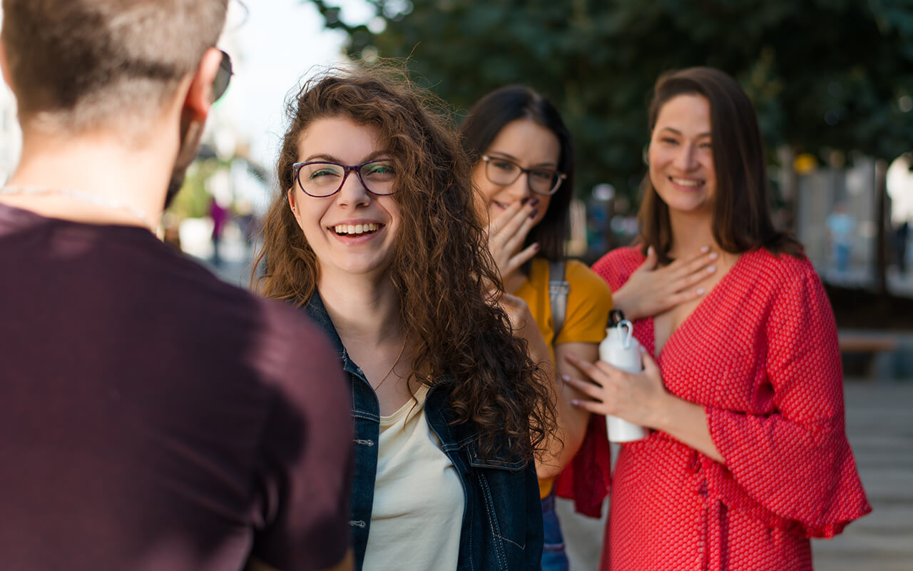 Woman smiling while greeting a stranger 