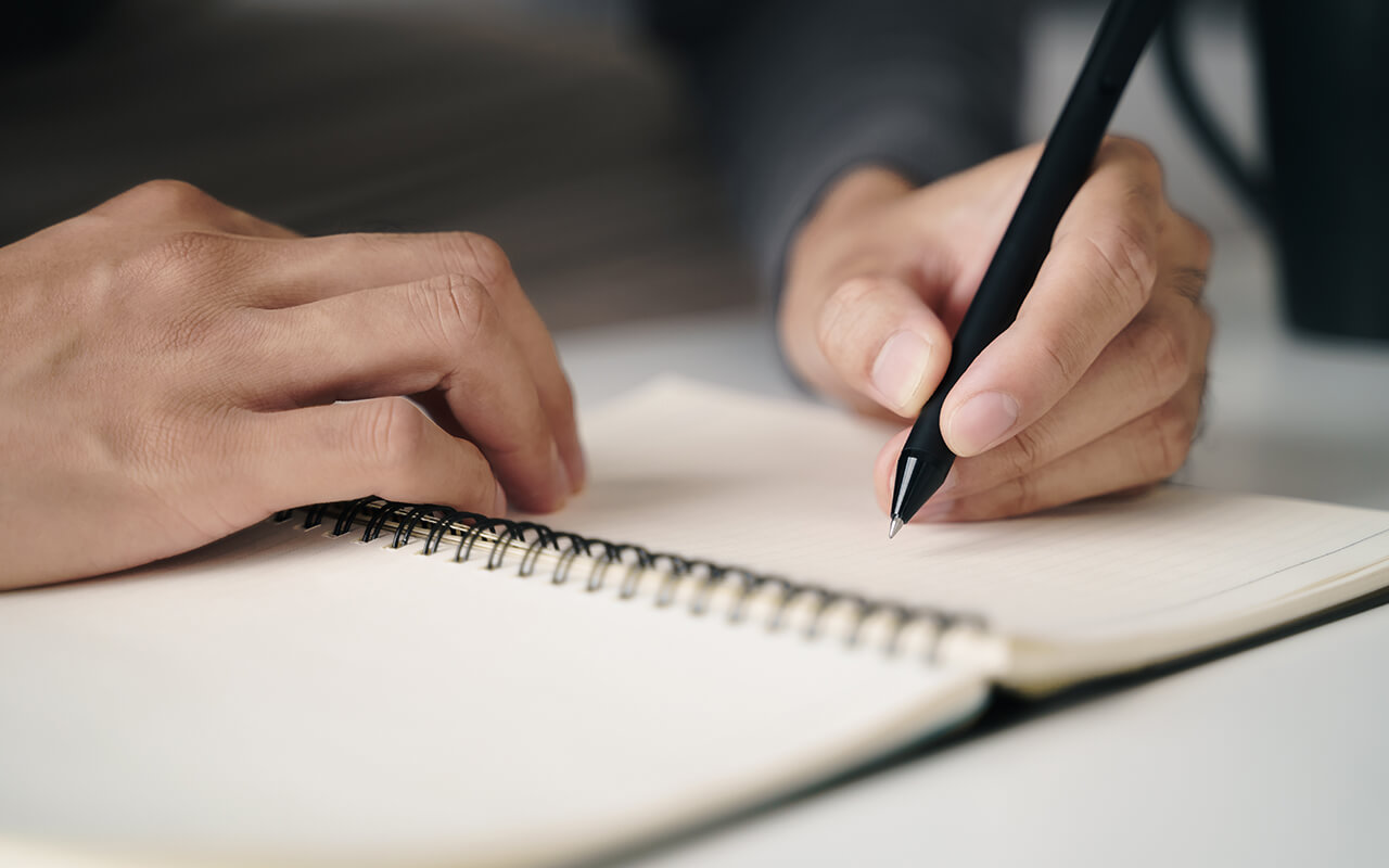Left handed person writing