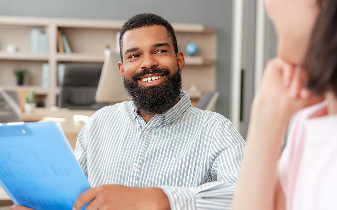 Smiling man in a meeting