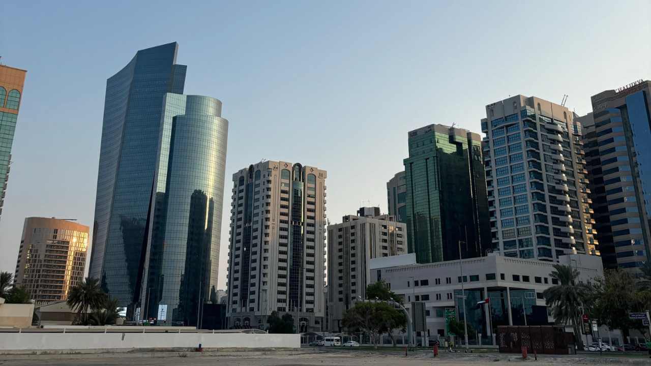 a group of tall buildings in the middle of a city