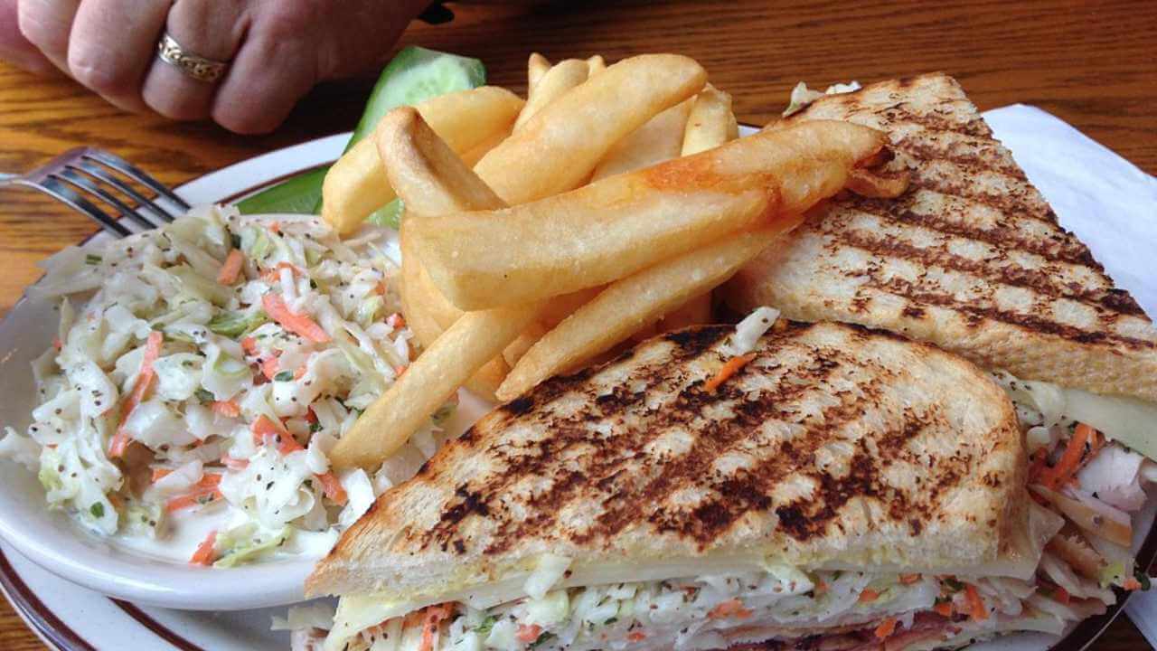 a sandwich and fries on a plate