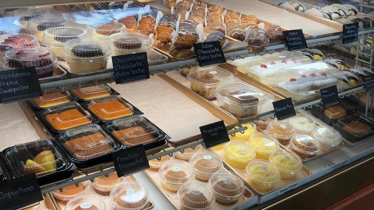 a display case filled with various types of desserts