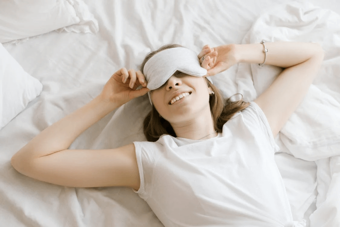 Woman with an eye mask on