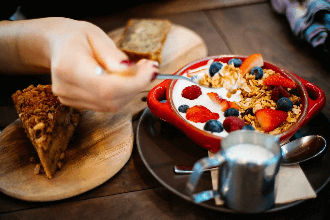 Person eating breakfast foods