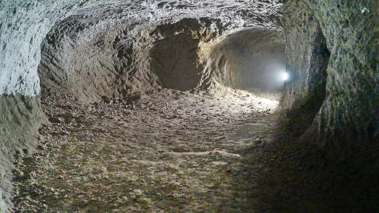 an image of a tunnel with a light coming out of it