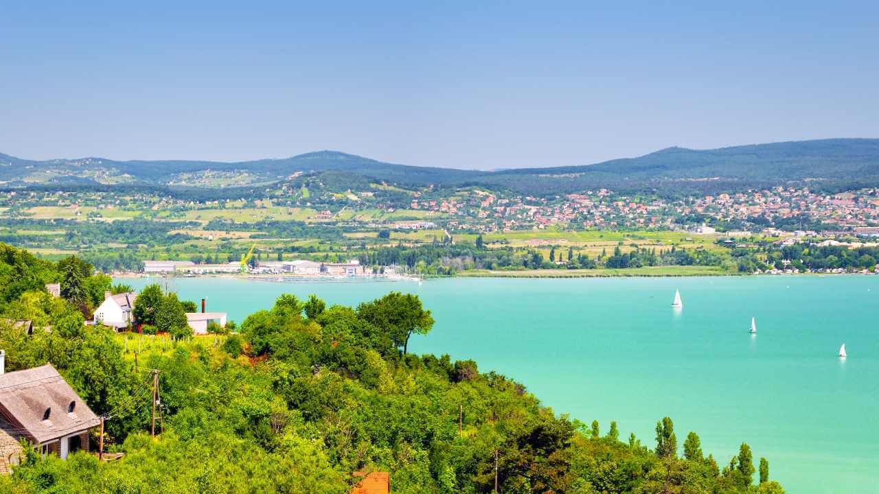 a scenic view of the lake and mountains in croatia