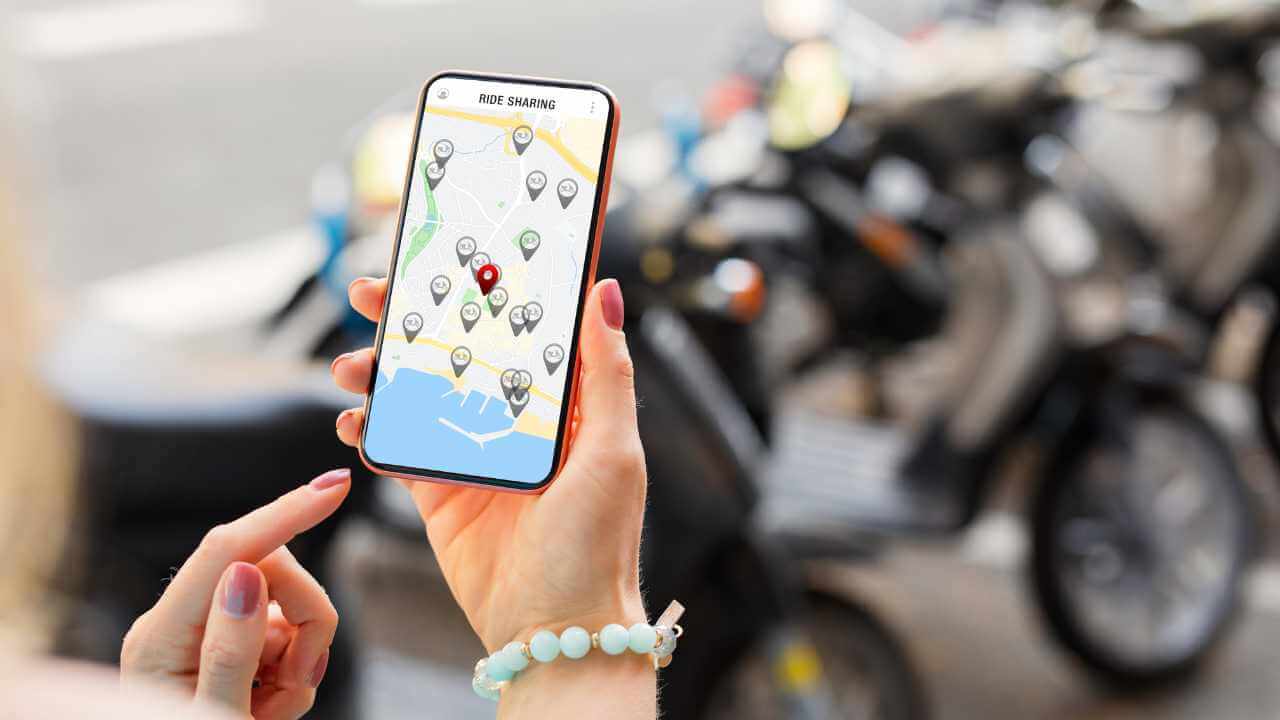 A person holding up a smart phone with a map on it