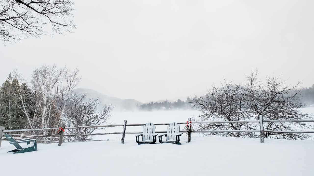 adirondack chairs in the snow