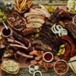 an assortment of food is laid out on a table