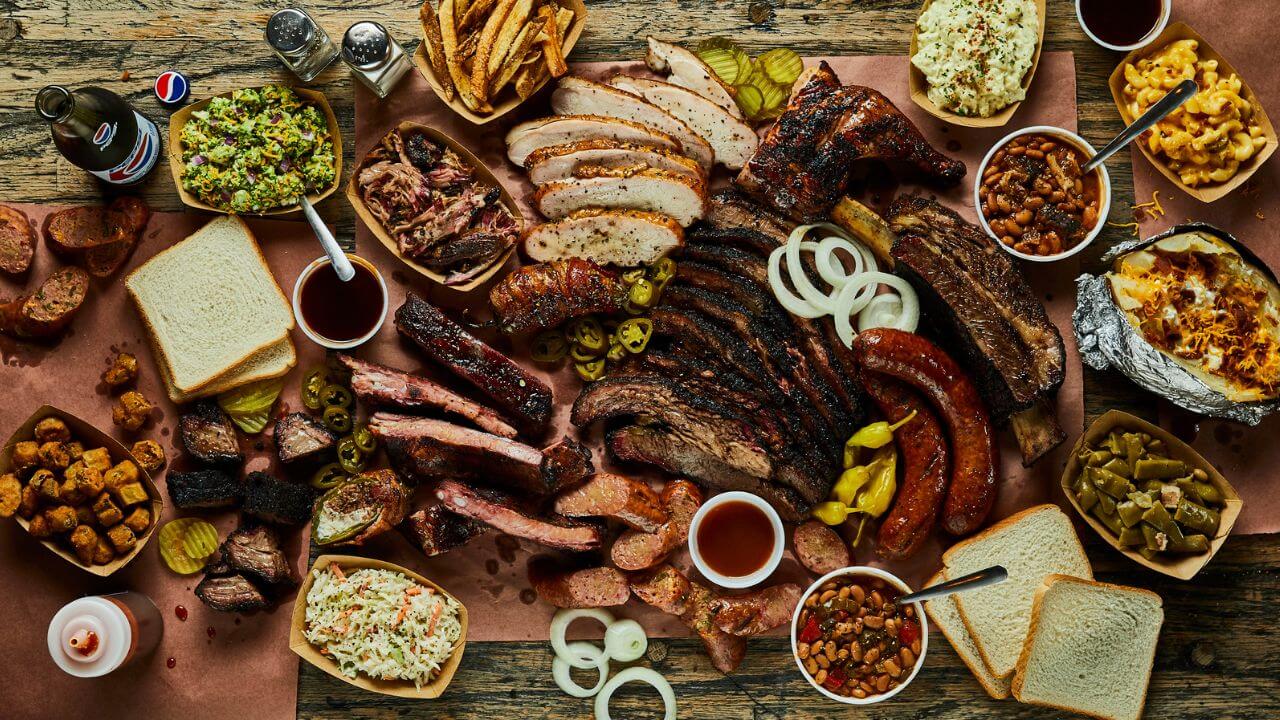 an assortment of food is laid out on a table