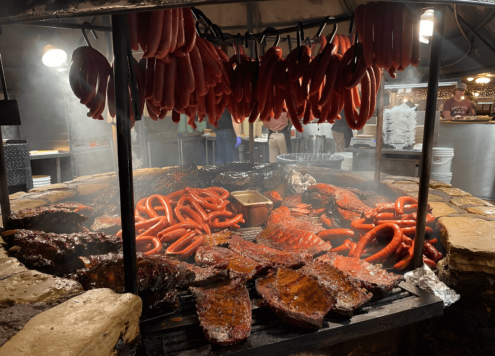bunch of meat on a grill