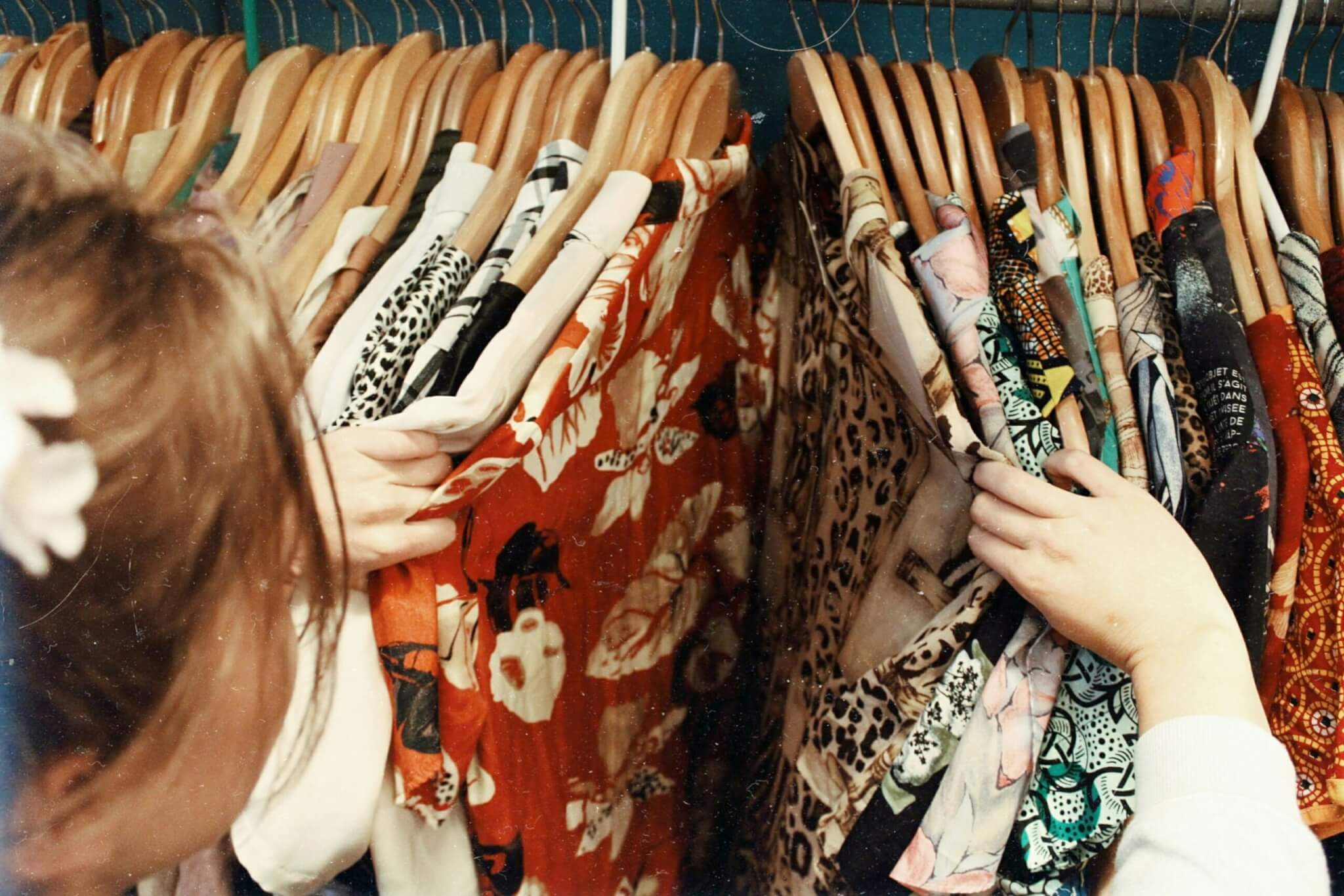 a woman scanning through clothes