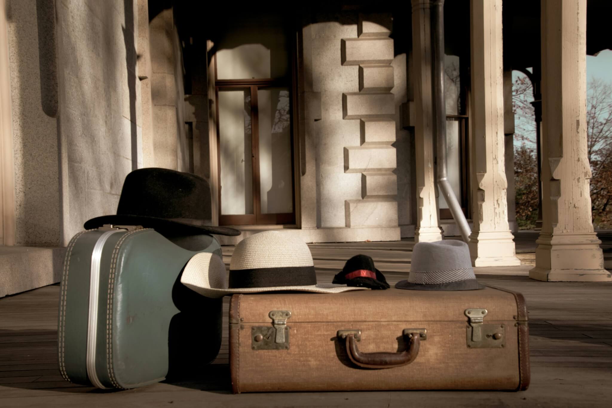 suitcase and hats