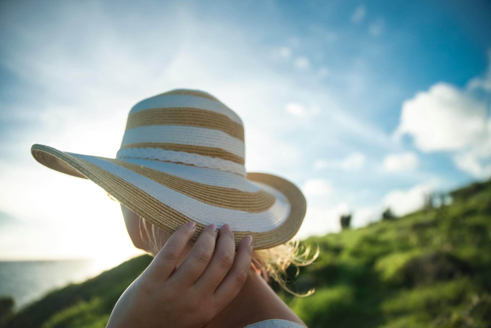 woman wearing a hat in the caribbean