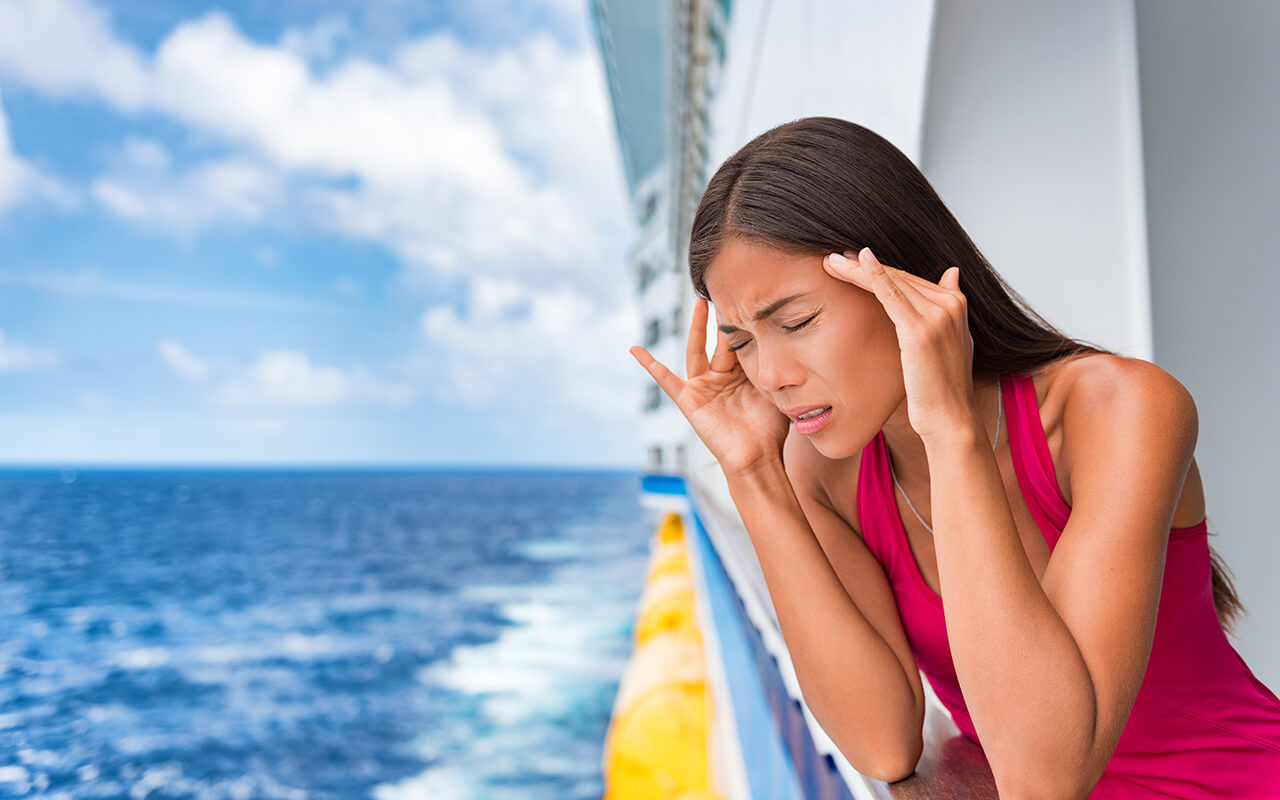 Woman with a headache on a cruise ship