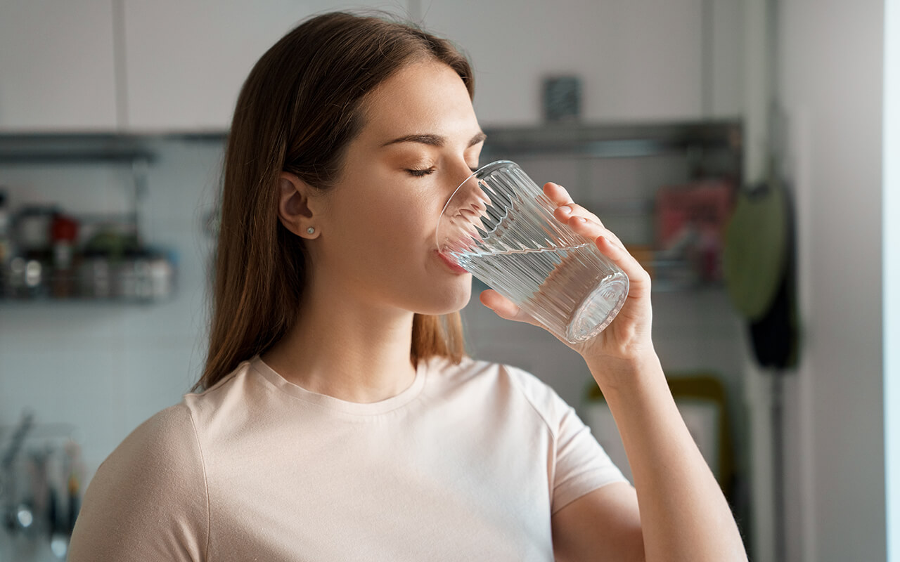 Woman drinking a glass of water