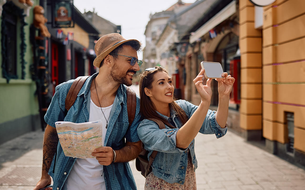 Happy tourists taking photos