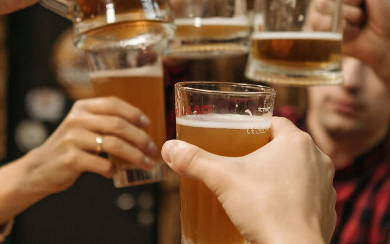 Group of people holding beers