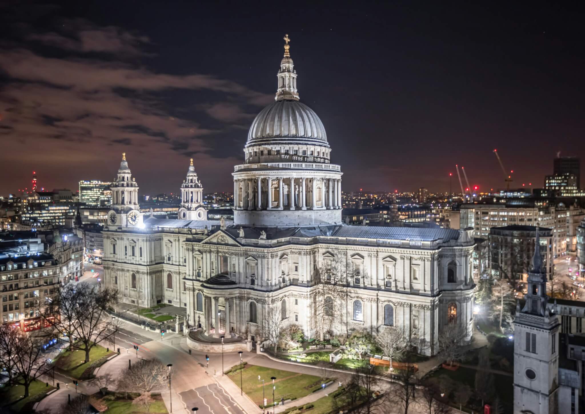 St. Paul’s Cathedral in London illuminated at night with its iconic dome and neoclassical details, a landmark for classical architecture lovers.