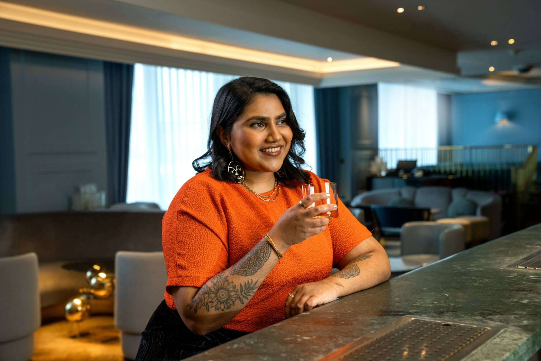 woman sitting at a bar