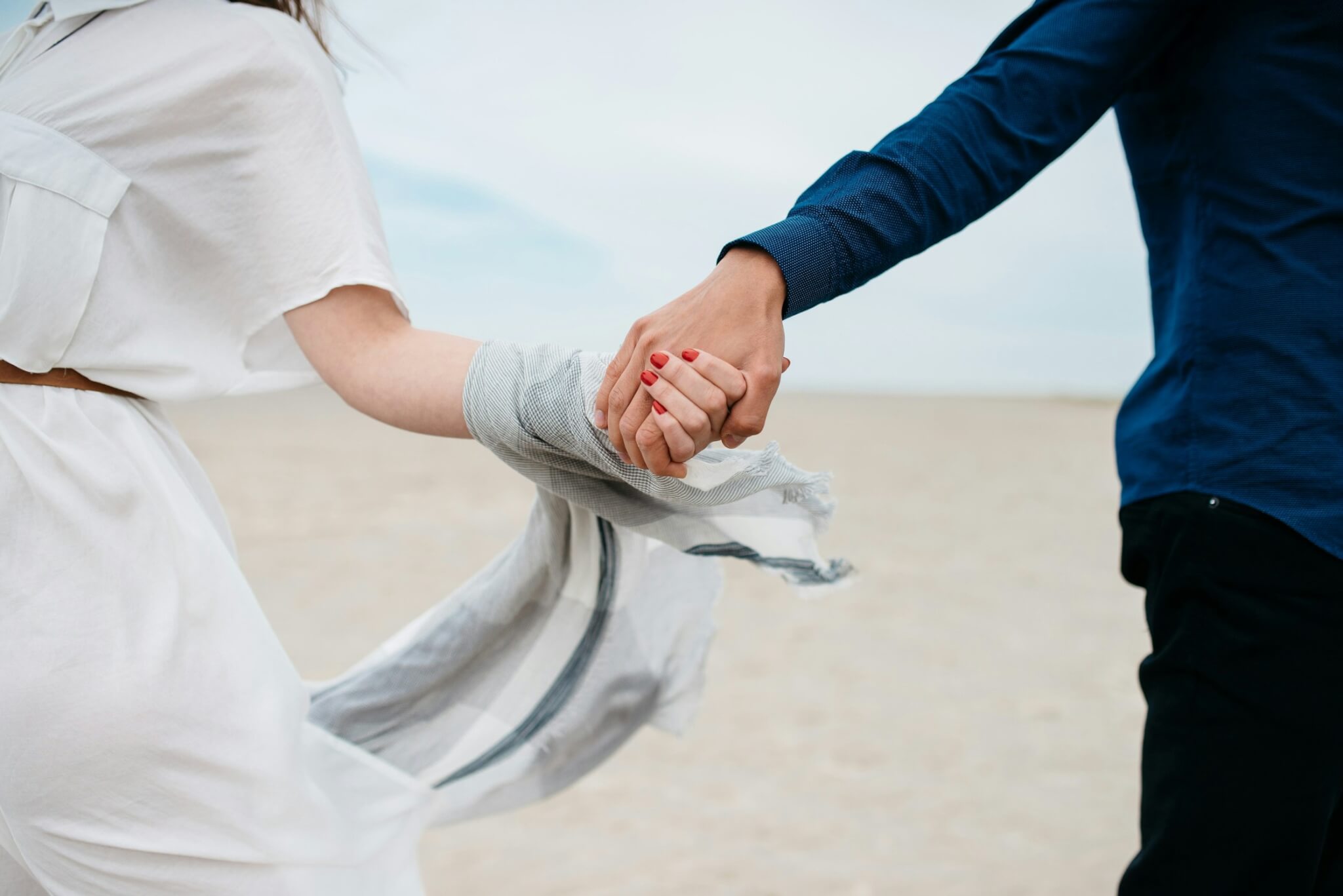 Couple holding hands