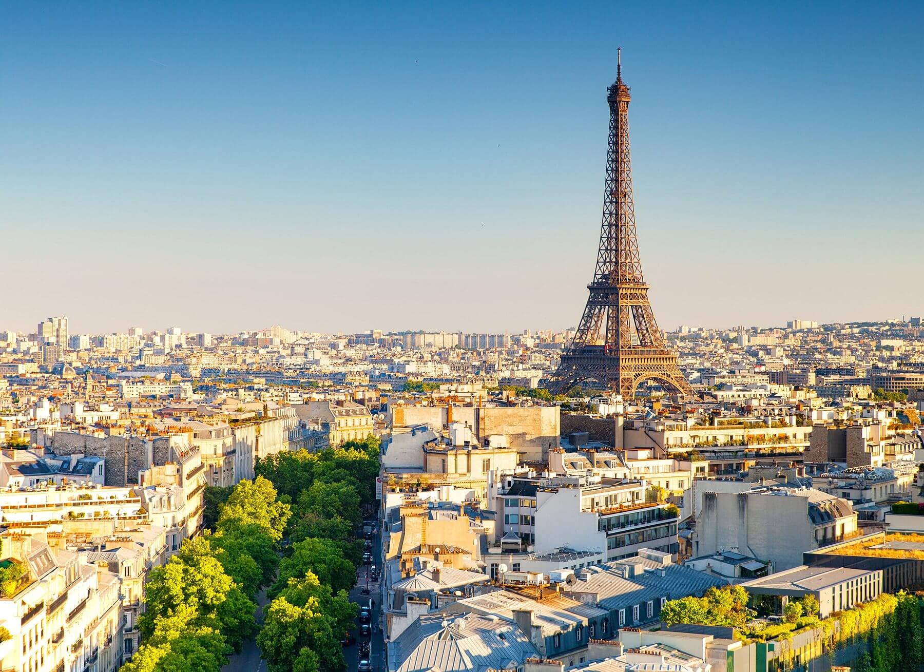 Panoramic view of Paris skyline with the Eiffel Tower at sunset