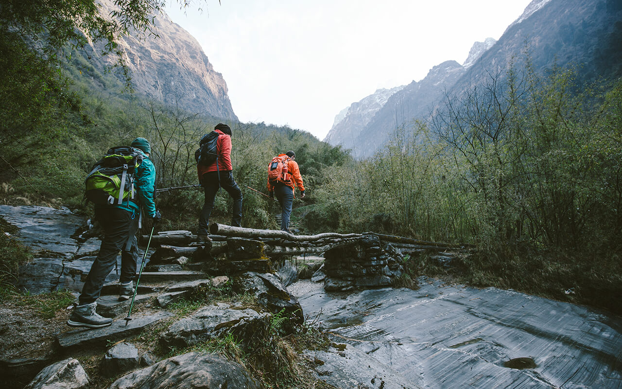 Group hiking through mountain terrain