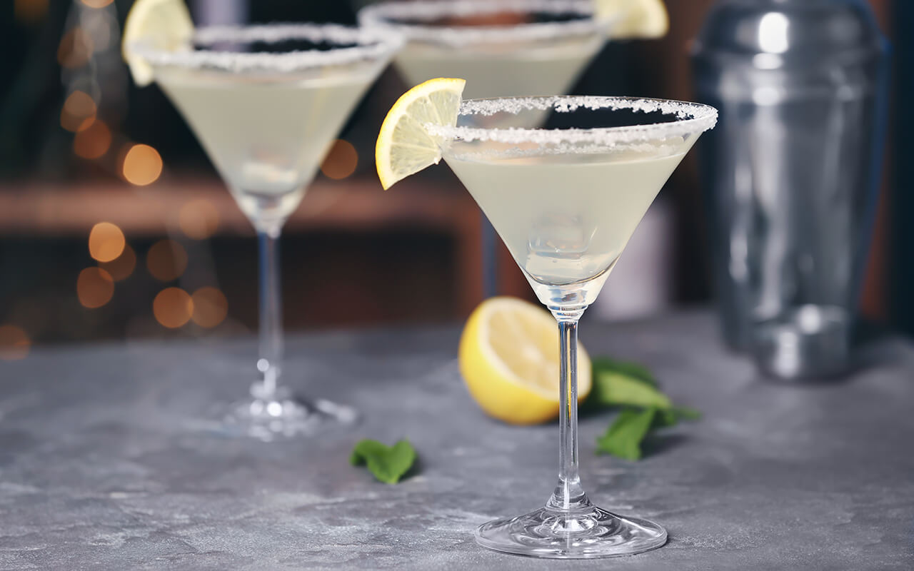 Martini glass with a lemon wedge on the rim