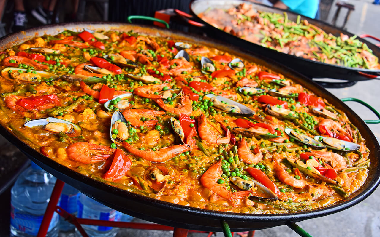 Spanish paella prepared in the street restaurant
