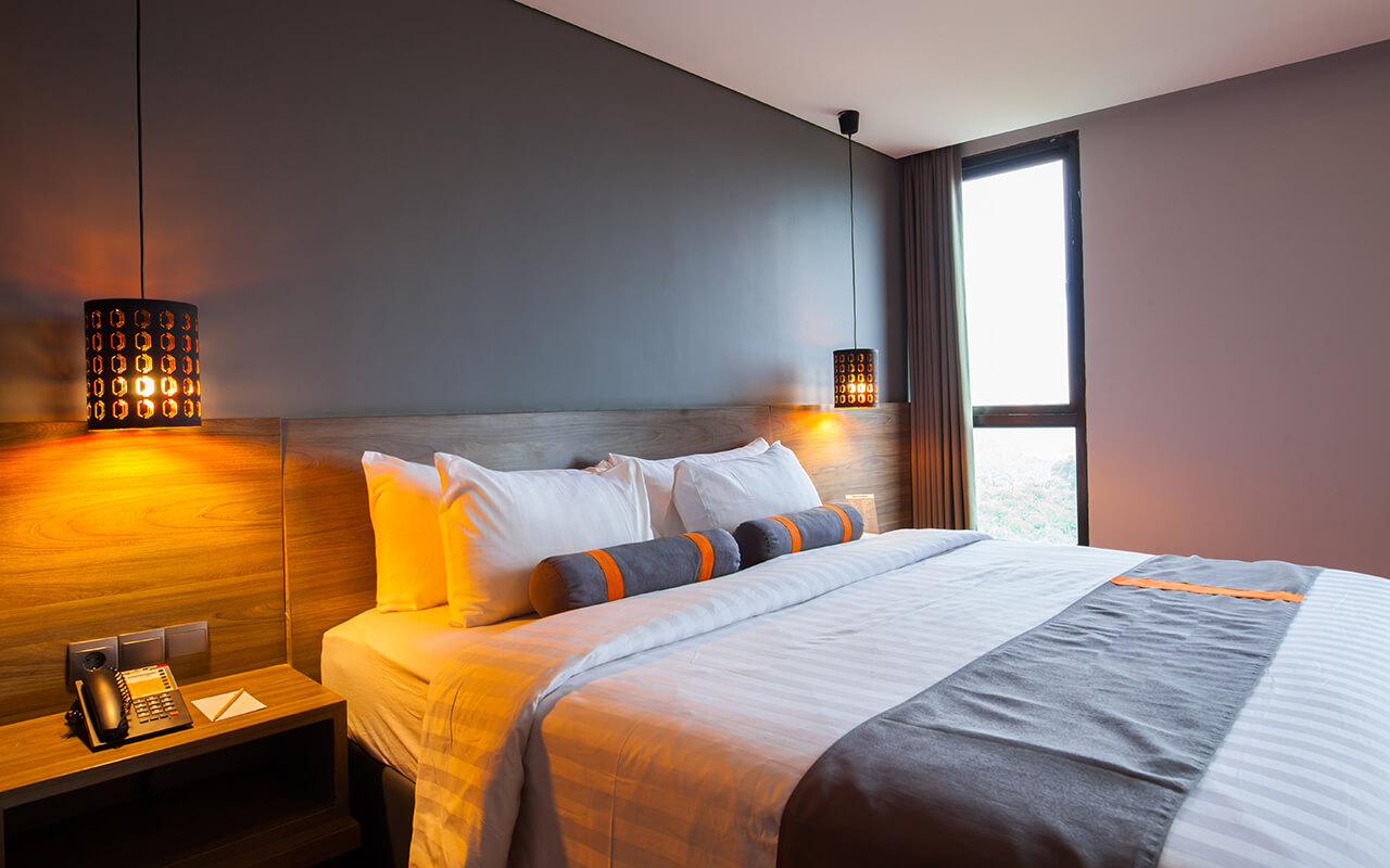 Clean hotel room with minimal lighting