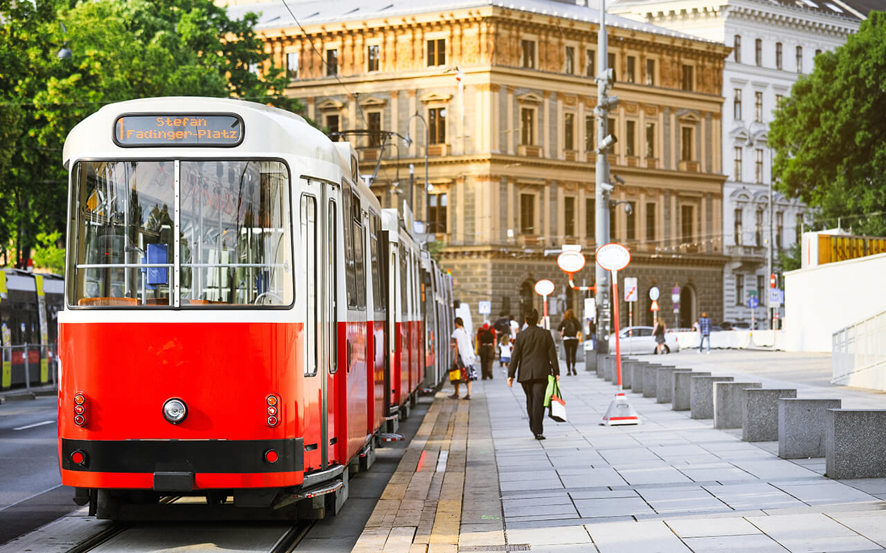 Old fashioned tram goes by the street of Vienna. Vienna is a capital and largest city of Austria