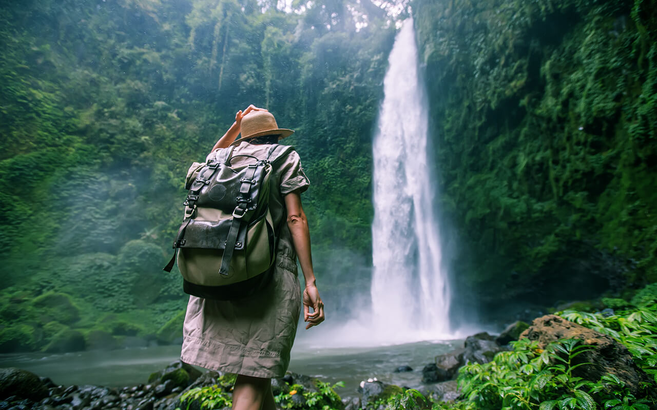 Woman near Nung Nung waterfal on Bali, Indonesia