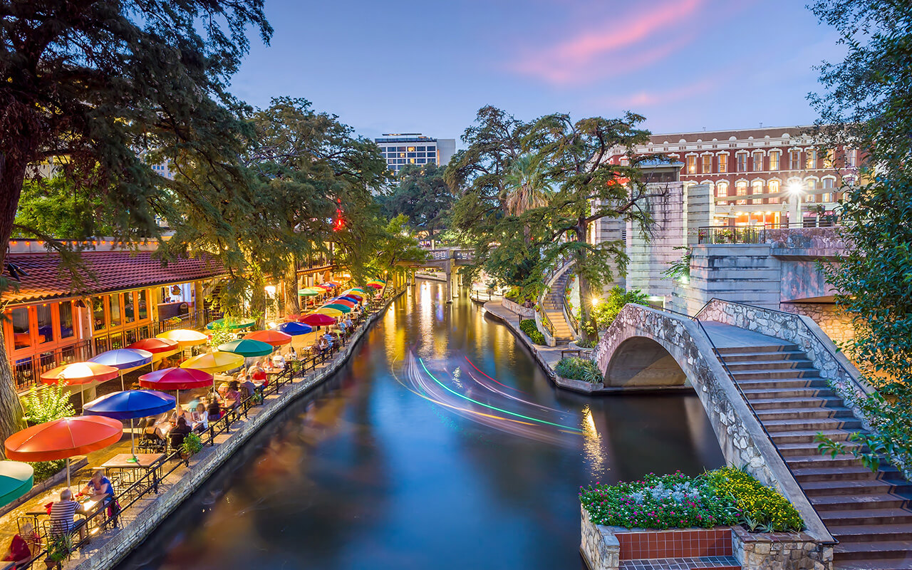 River walk in San Antonio city downtown skyline cityscape of Texas USA