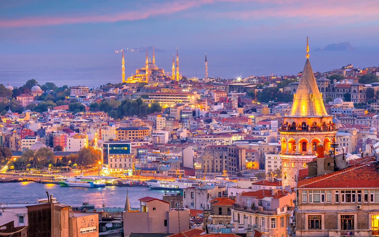 Sunset skyline of Istanbul featuring Galata Tower and historic buildings
