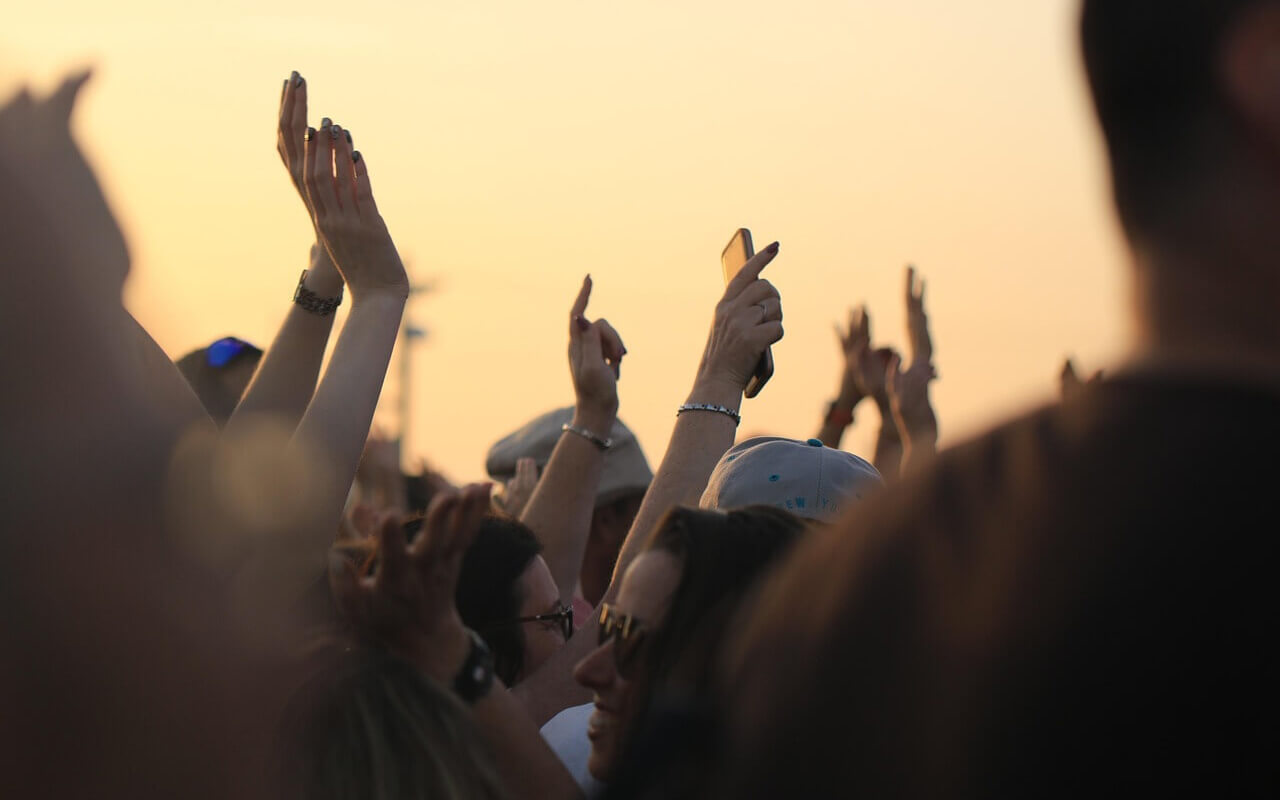 Hands up in a concert crowd.